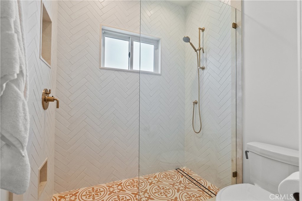 23477 Park Colombo Calabasas, CA 91302 - Photo 41 of 56 a bathroom with a shower and toilet