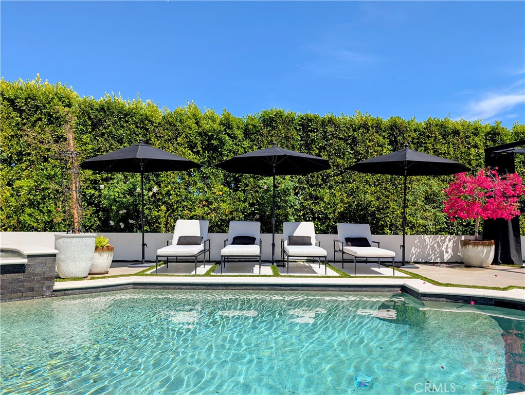 23477 Park Colombo Calabasas, CA 91302 - Photo 44 of 54 a view of pool with table and chairs under an umbrella