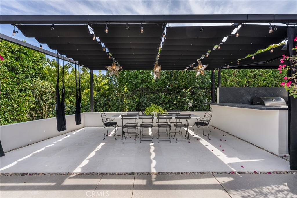 23477 Park Colombo Calabasas, CA 91302 - Photo 48 of 56 a view of a patio with table and chairs with plants