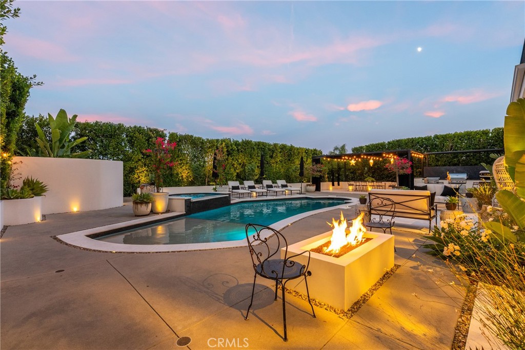 23477 Park Colombo Calabasas, CA 91302 - Photo 50 of 54 a view of a swimming pool with lounge chairs