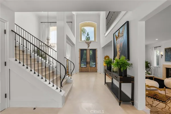 a view of hall way with furniture
