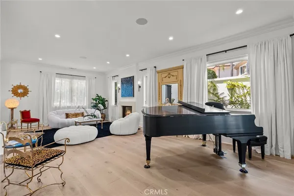 a living room with furniture a window and a table