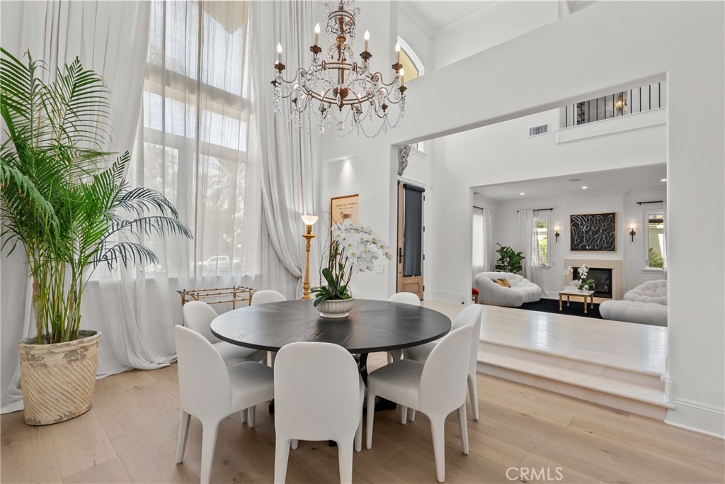23477 Park Colombo Calabasas, CA 91302 - Photo 10 of 56 a view of a dining room with furniture window and wooden floor