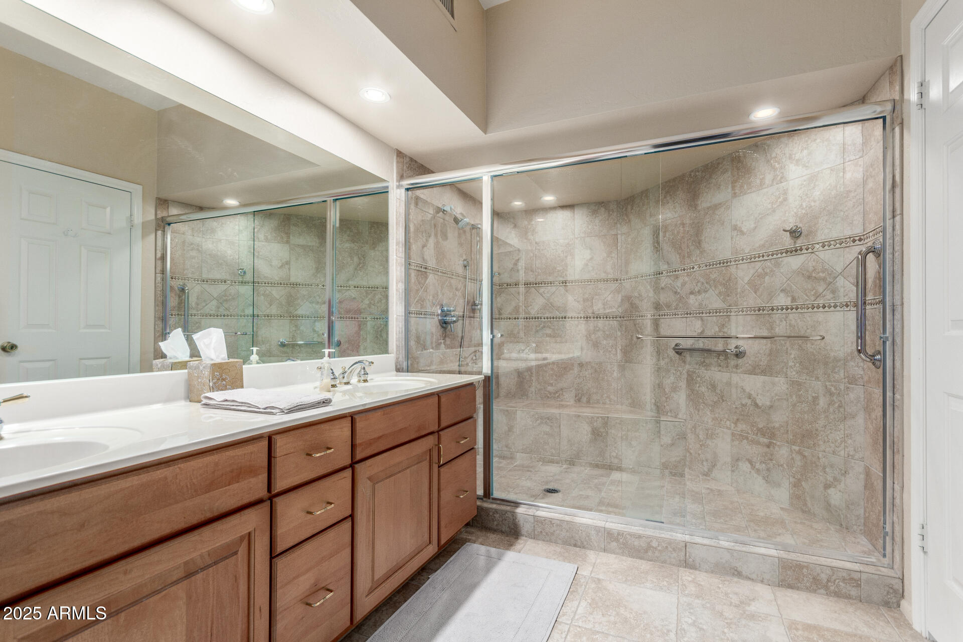 10019 East Mountain View Road, Unit 1121 Scottsdale, AZ 85258 - Photo 16 of 39 a bathroom with a shower sink and mirror