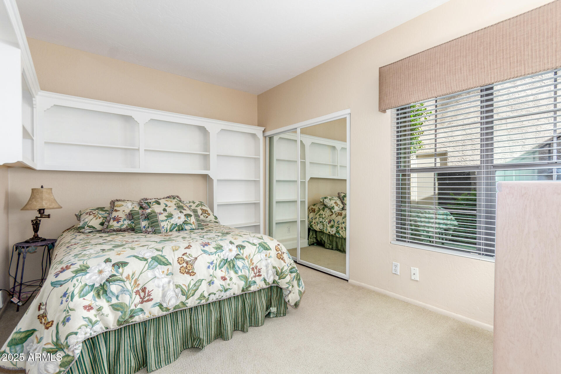 10019 East Mountain View Road, Unit 1121 Scottsdale, AZ 85258 - Photo 18 of 39 a bedroom with a bed and a window