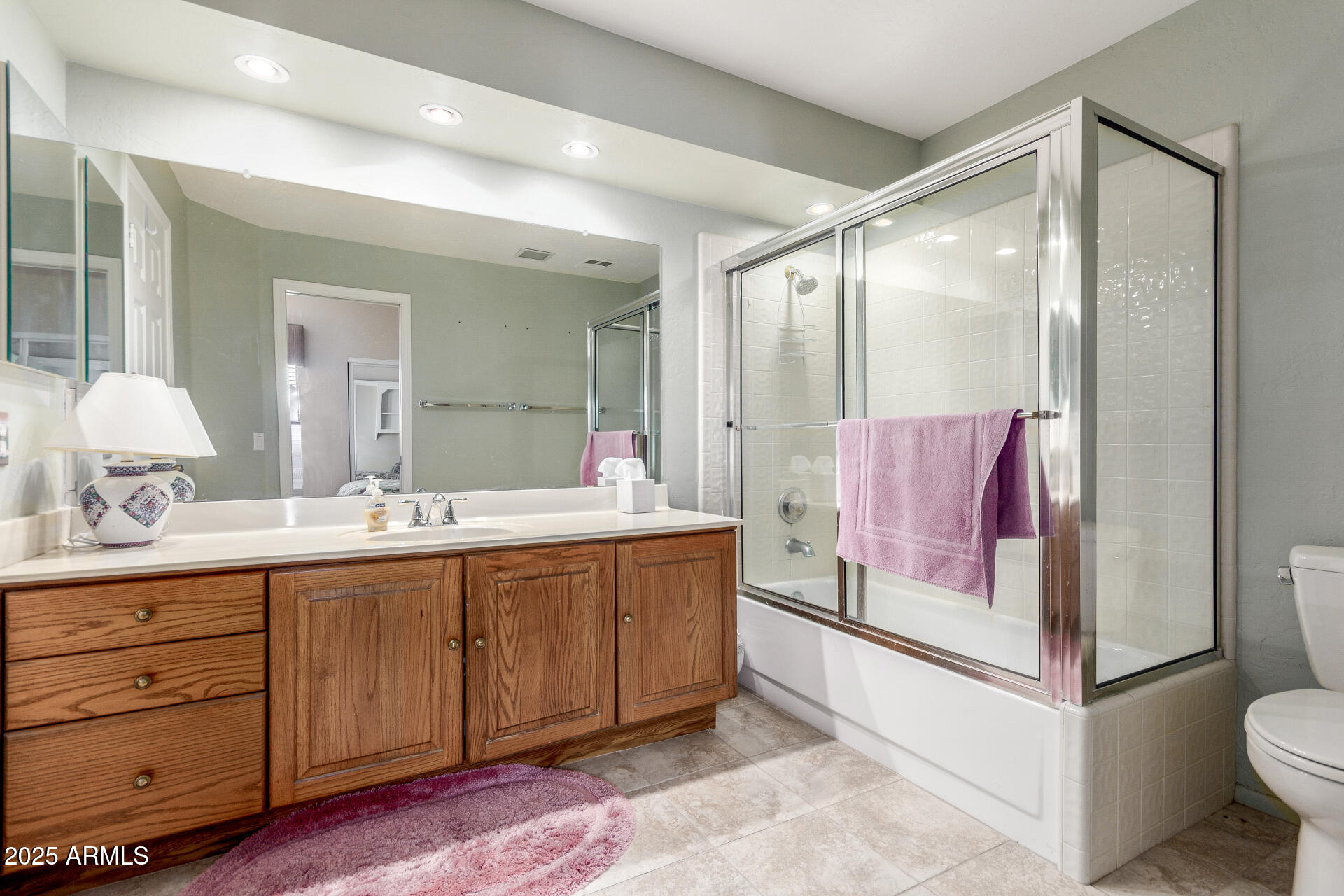 10019 East Mountain View Road, Unit 1121 Scottsdale, AZ 85258 - Photo 20 of 39 a spacious bathroom with a shower sink and mirror