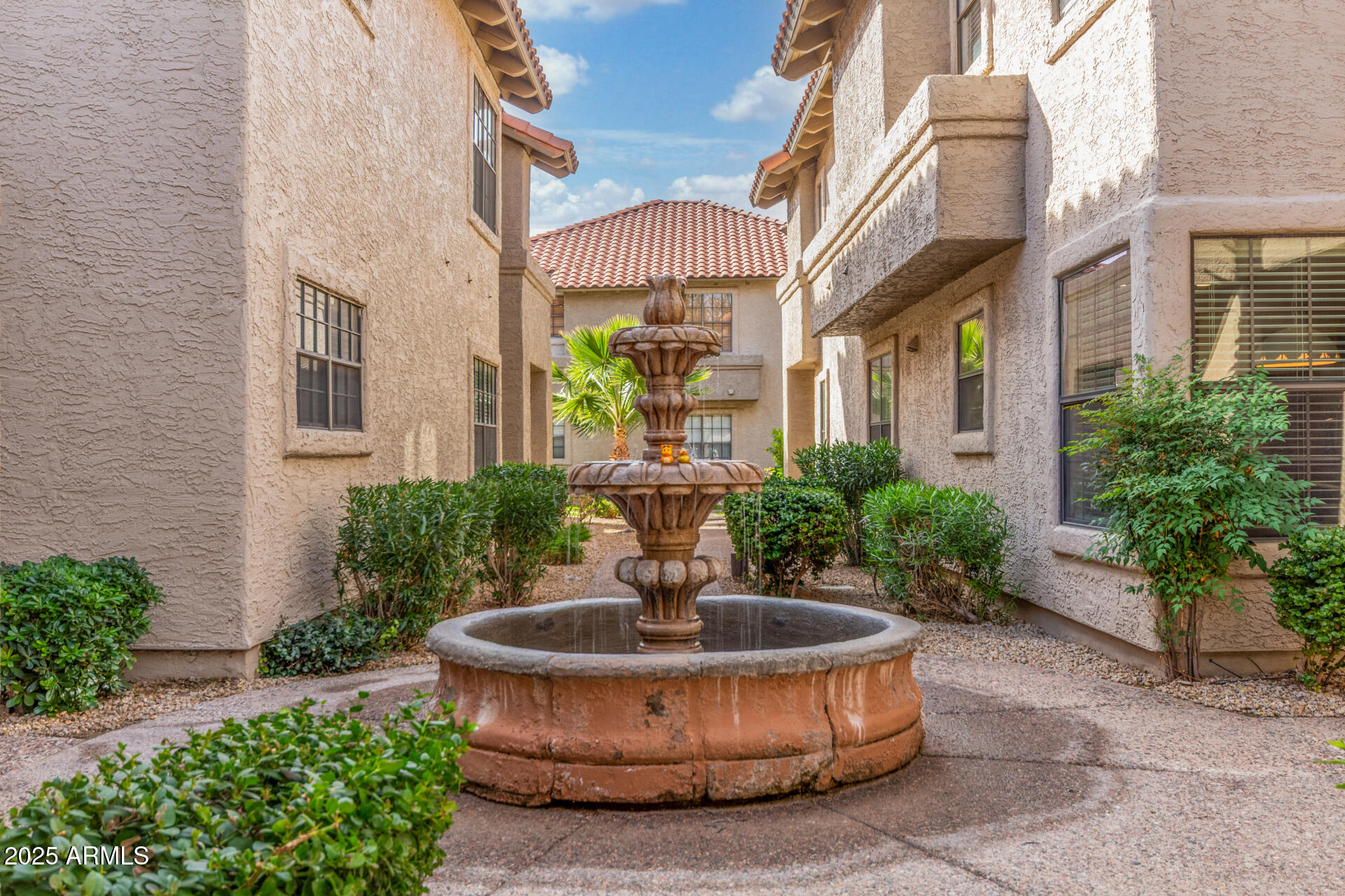 10019 East Mountain View Road, Unit 1121 Scottsdale, AZ 85258 - Photo 28 of 39 a front view of a house with plants