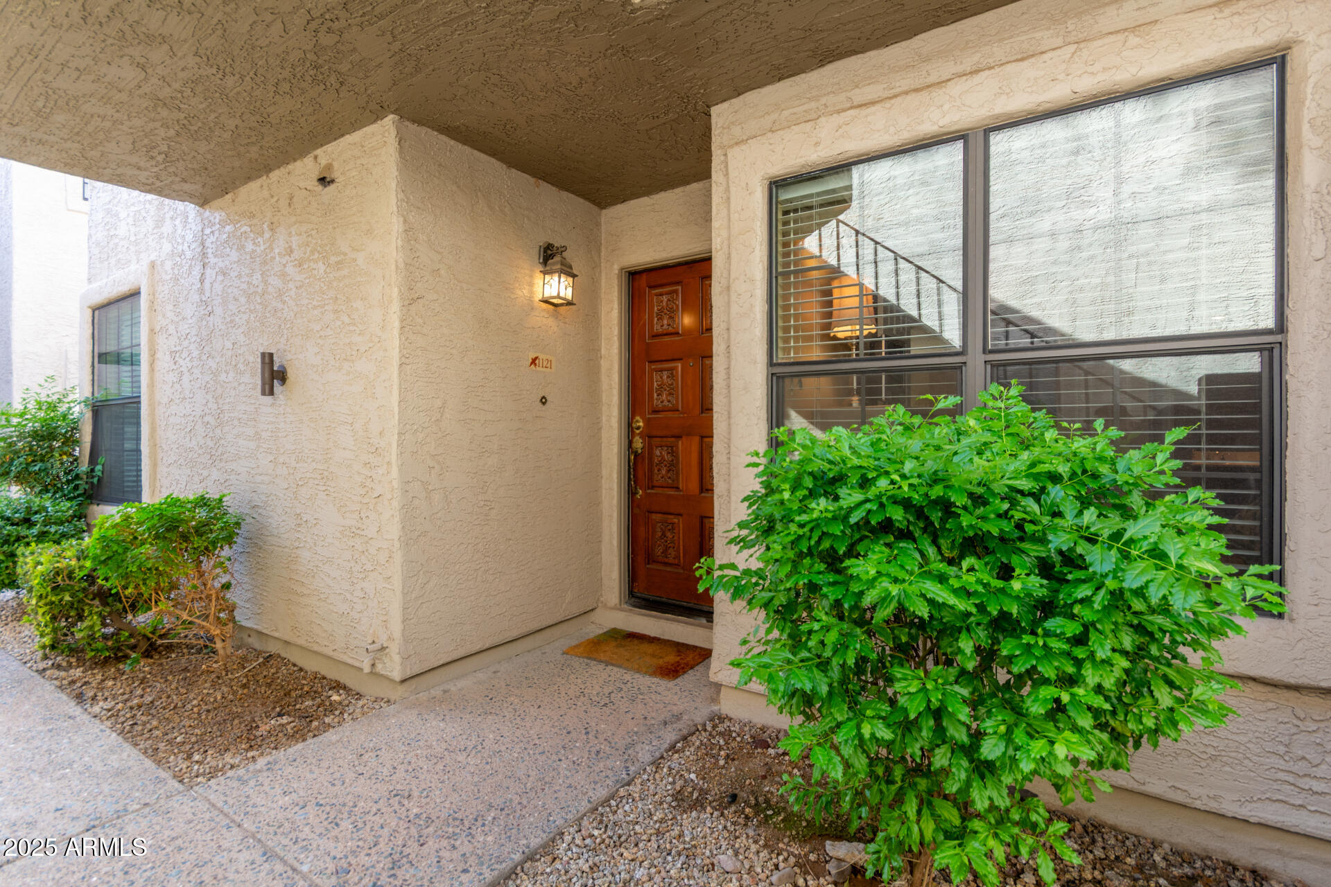 10019 East Mountain View Road, Unit 1121 Scottsdale, AZ 85258 - Photo 37 of 39 a view of a back yard from a corridor