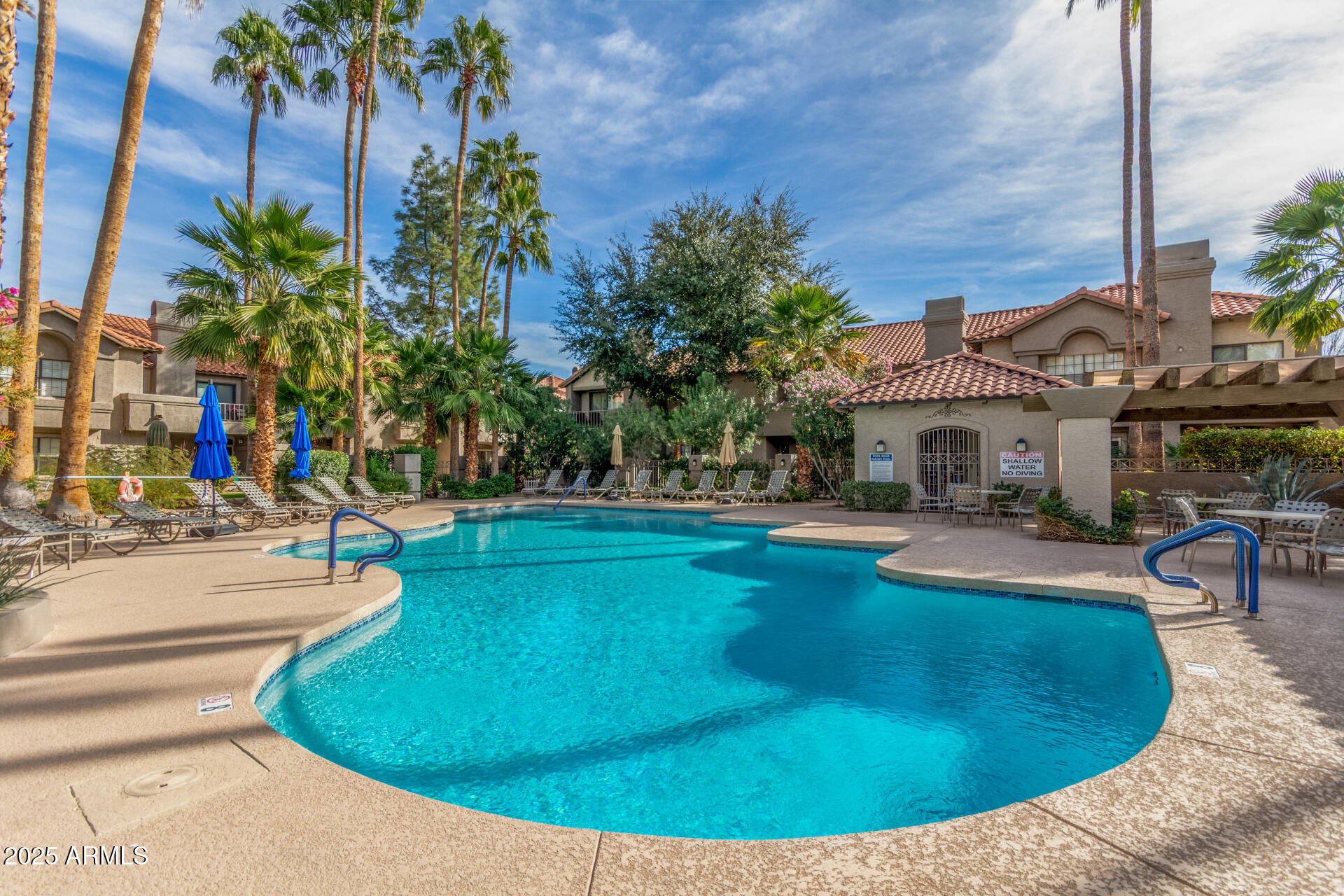 10019 East Mountain View Road, Unit 1121 Scottsdale, AZ 85258 - Photo 3 of 39 a view of a swimming pool with outdoor seating
