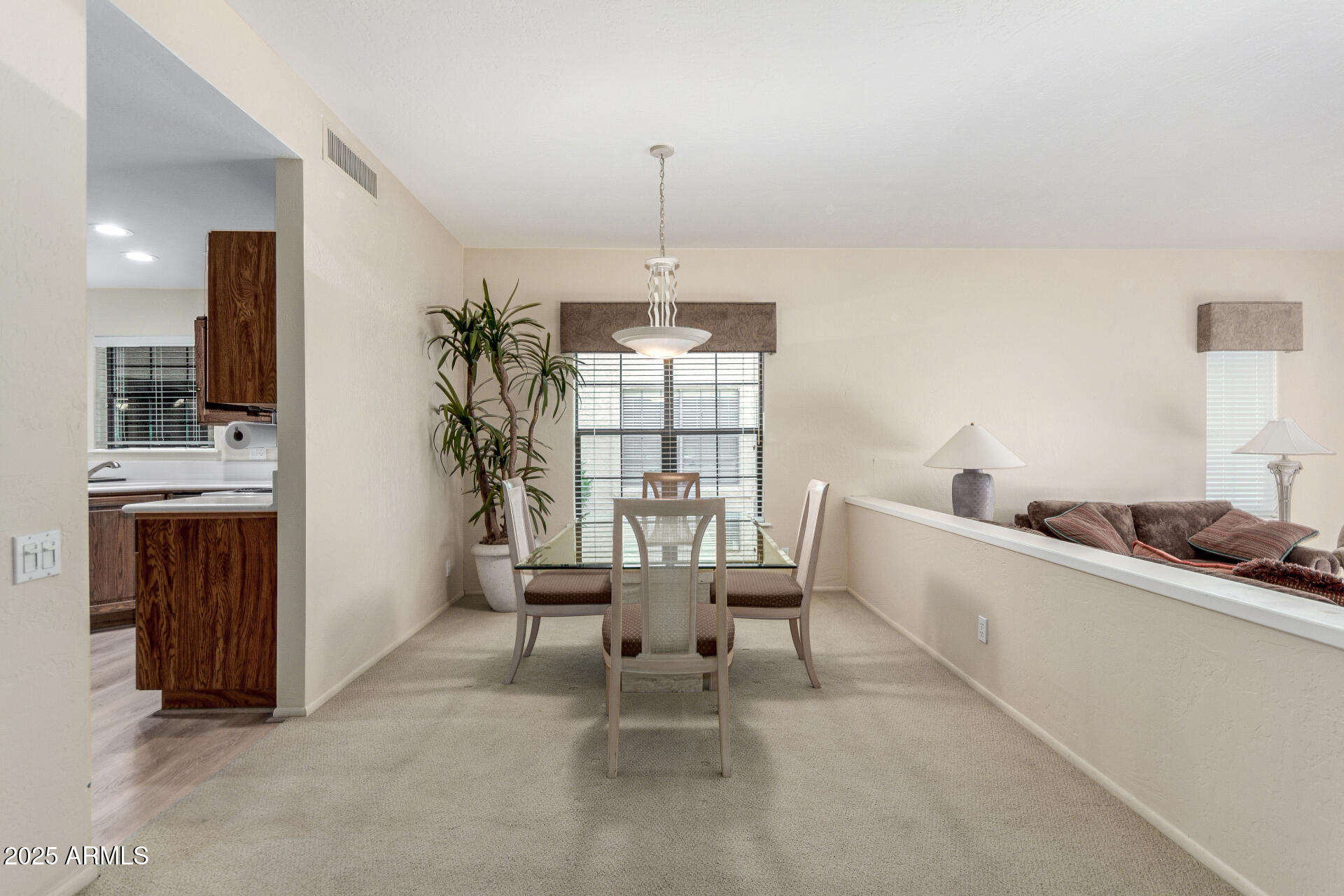 10019 East Mountain View Road, Unit 1121 Scottsdale, AZ 85258 - Photo 5 of 39 a dining room with furniture and window