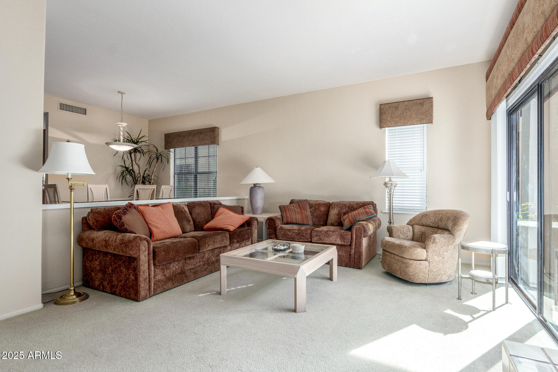 10019 East Mountain View Road, Unit 1121 Scottsdale, AZ 85258 - Photo 9 of 39 a living room with furniture and a large window
