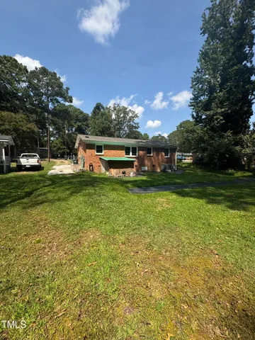 a view of a house with a big yard