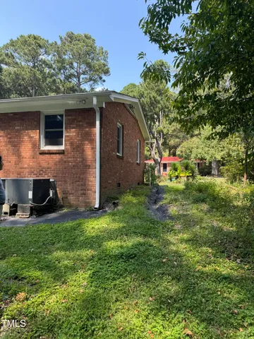a backyard of a house with lots of green space