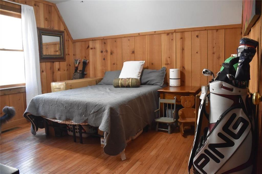 716 Moss Patch Trail Jasper, GA 30143 - Photo 8 of 26 a bedroom with a bed and wooden floor