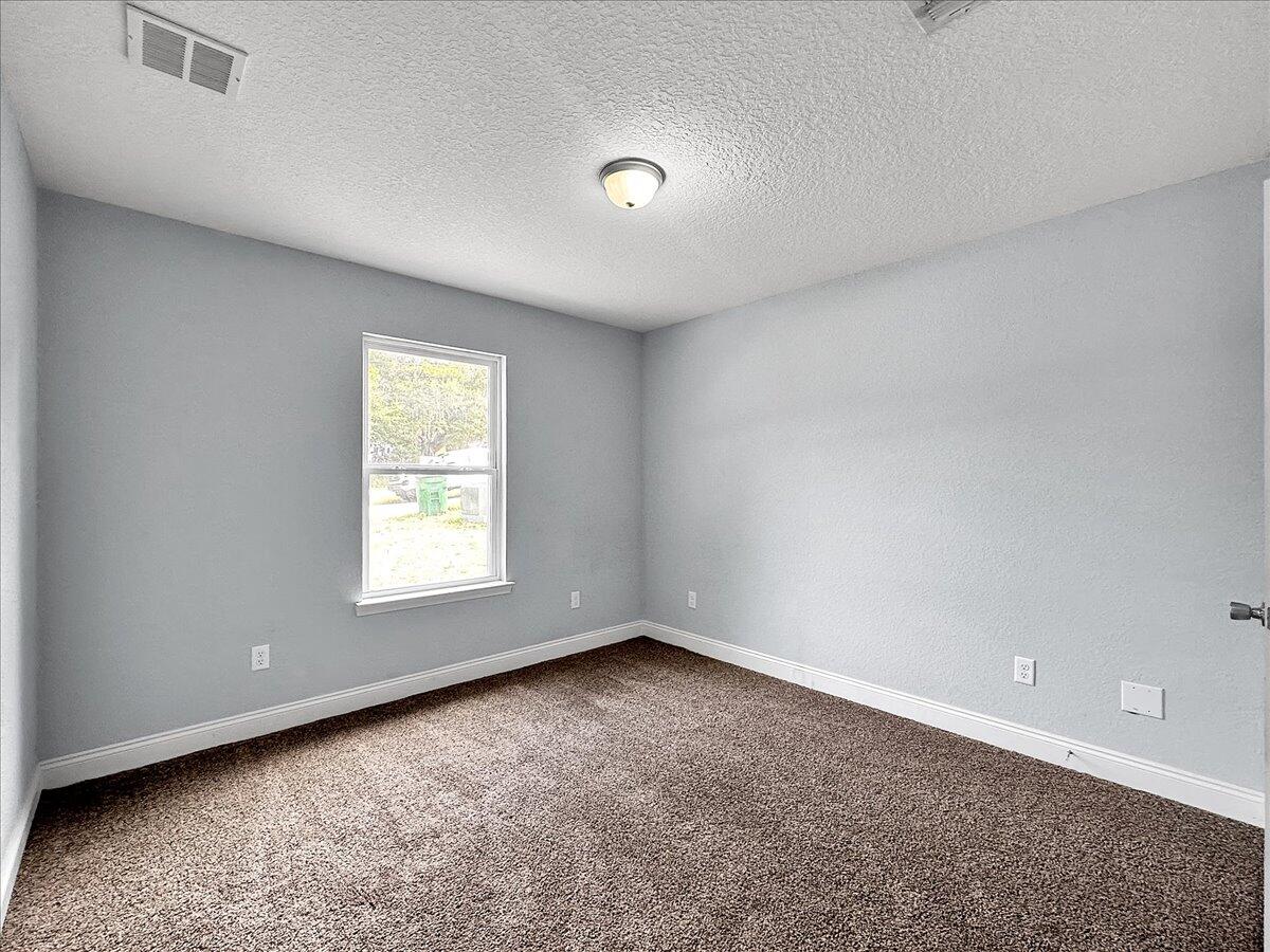 2970 Stillwell Boulevard Crestview, FL 32539 - Photo 15 of 20 an empty room with a window