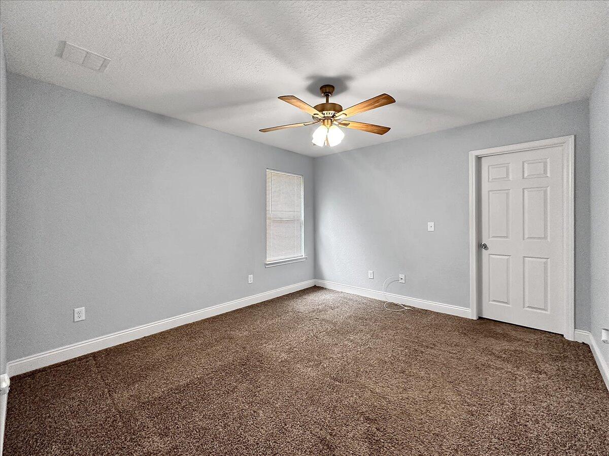 2970 Stillwell Boulevard Crestview, FL 32539 - Photo 16 of 20 wooden floor in an empty room with a window