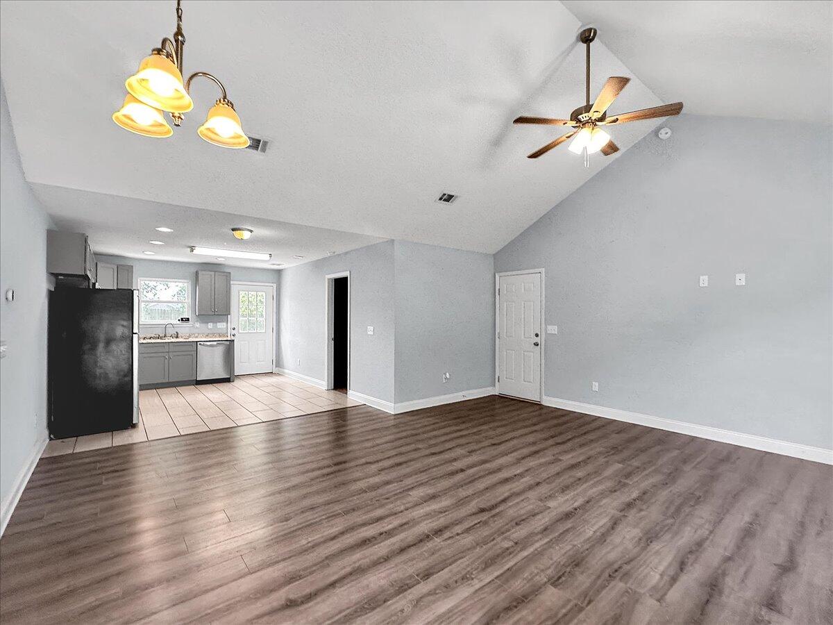 2970 Stillwell Boulevard Crestview, FL 32539 - Photo 18 of 20 a view of empty room with wooden floor and ceiling fan