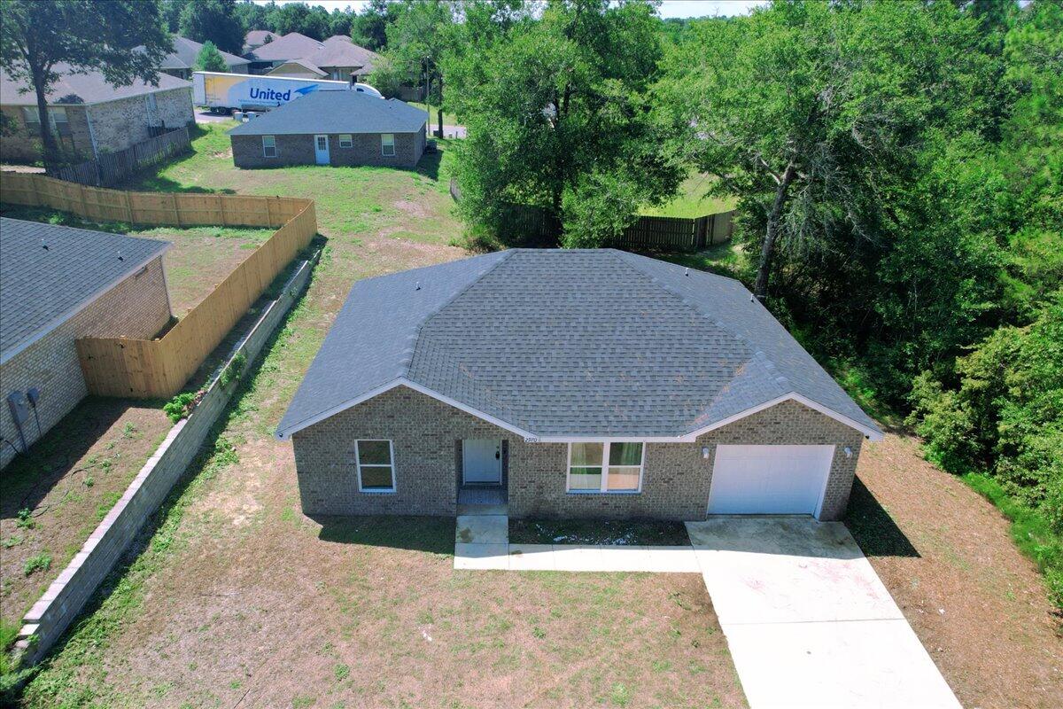2970 Stillwell Boulevard Crestview, FL 32539 - Photo 19 of 20 a front view of a house with a yard