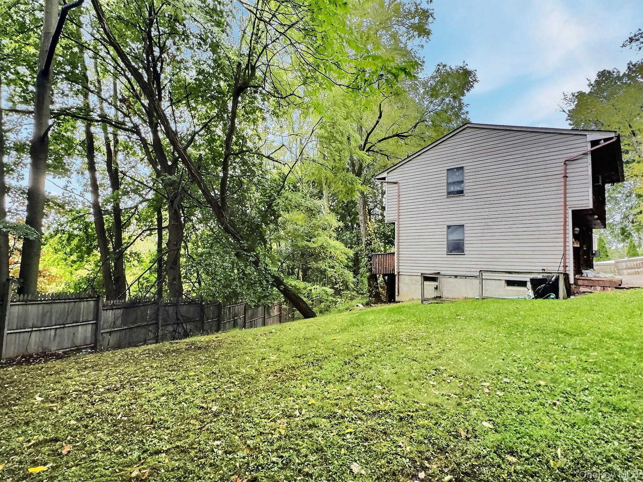 28 Wilson Place Cornwall, NY 12518 - Photo 3 of 24 a view of a backyard with a small cabin