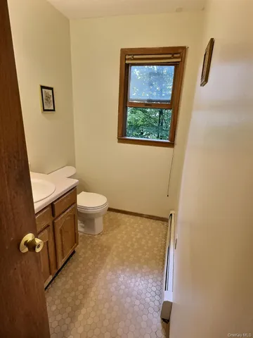 a bathroom with a toilet sink and a tub