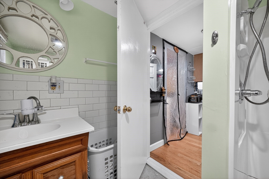 5 South Webster Street Haverhill, MA 01835 - Photo 12 of 15 a bathroom with a sink and a mirror