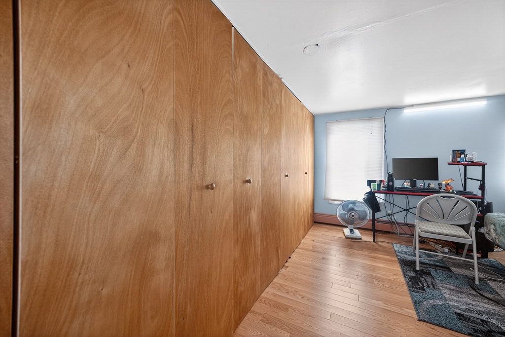 5 South Webster Street Haverhill, MA 01835 - Photo 14 of 15 a living room with furniture and a wooden floor