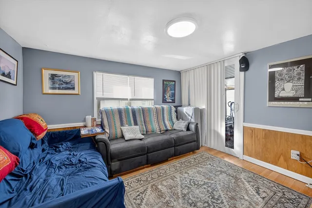 a living room with furniture and a rug
