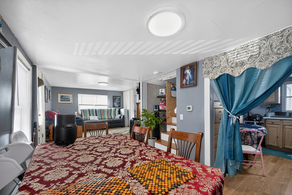 5 South Webster Street Haverhill, MA 01835 - Photo 8 of 15 a bed room with a bed and a chandelier