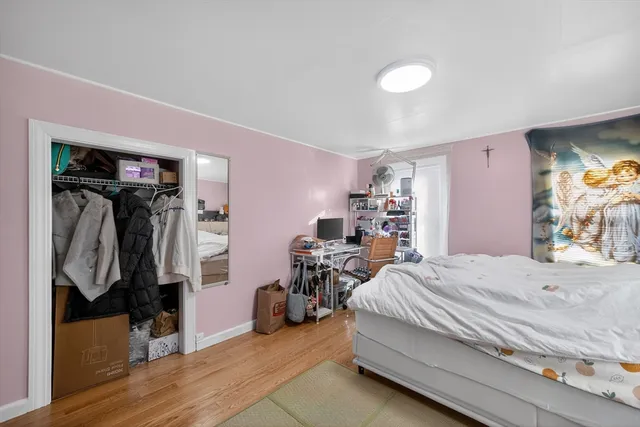 a bedroom with a bed and a walk in closet