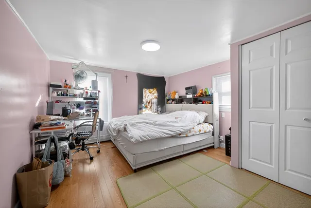 a bedroom with a bed and furniture