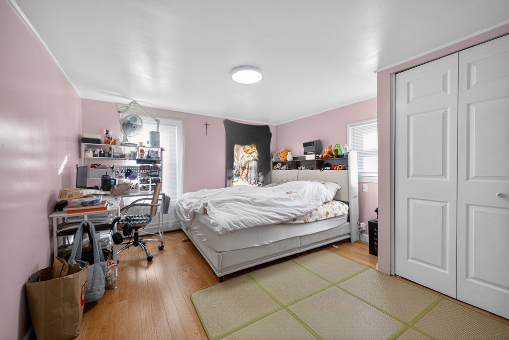 5 South Webster Street Haverhill, MA 01835 - Photo 10 of 15 a bedroom with a bed and furniture