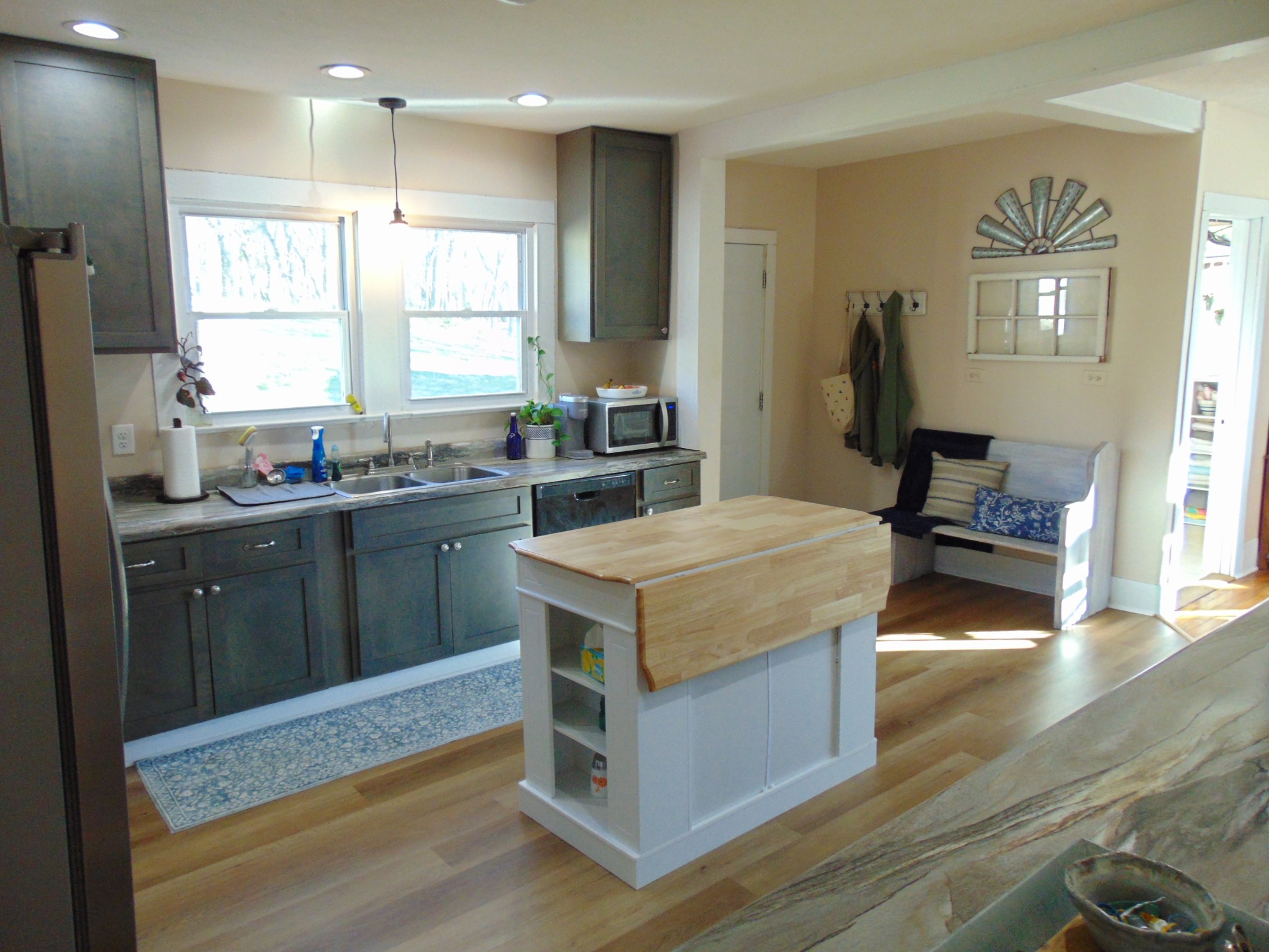 3547 Coffey Branch Road Cornersville, TN 37047 - Photo 17 of 57 a kitchen with kitchen island a sink dishwasher stove and wooden cabinets