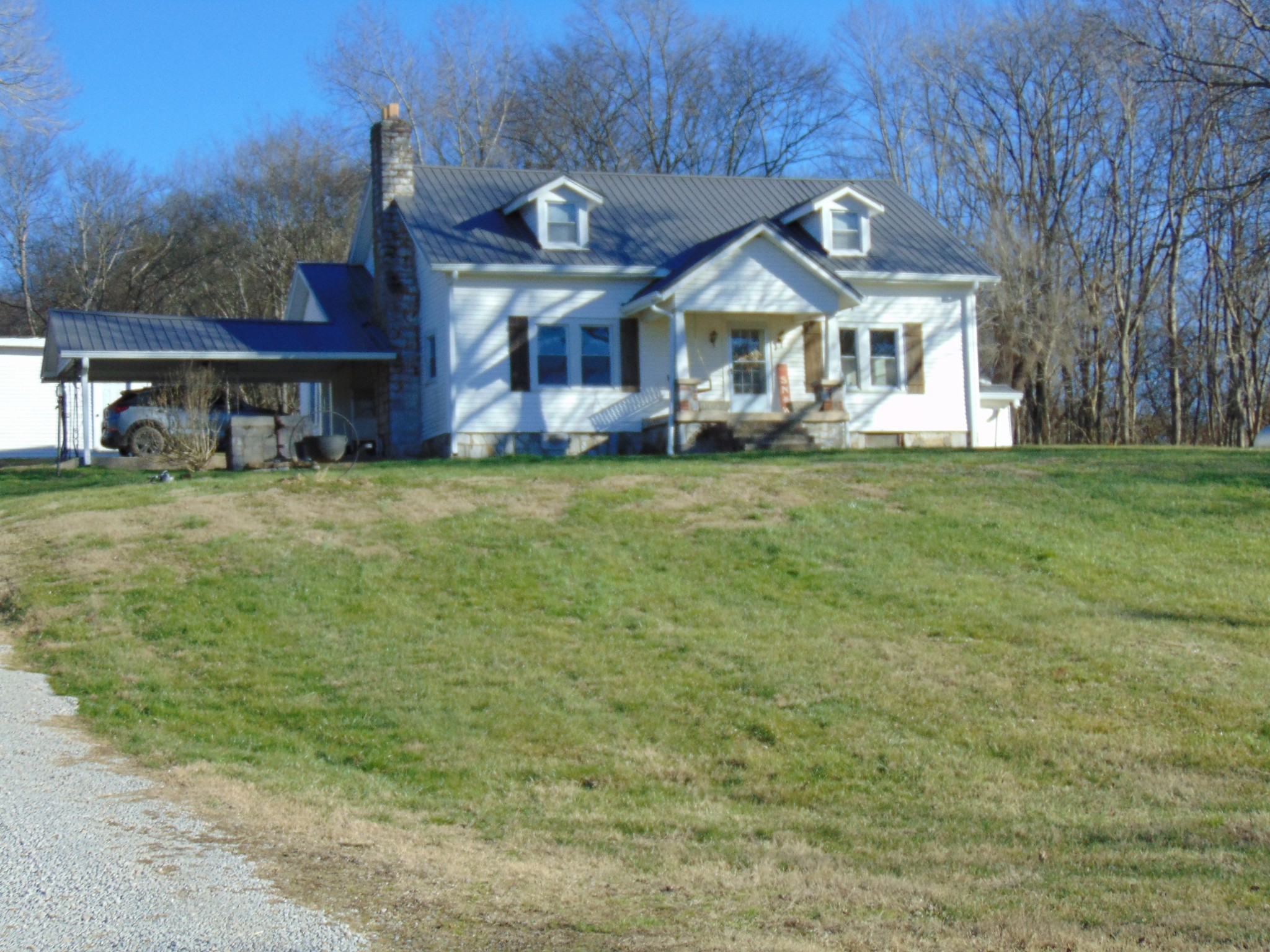 3547 Coffey Branch Road Cornersville, TN 37047 - Photo 55 of 57 a front view of a house with a garden