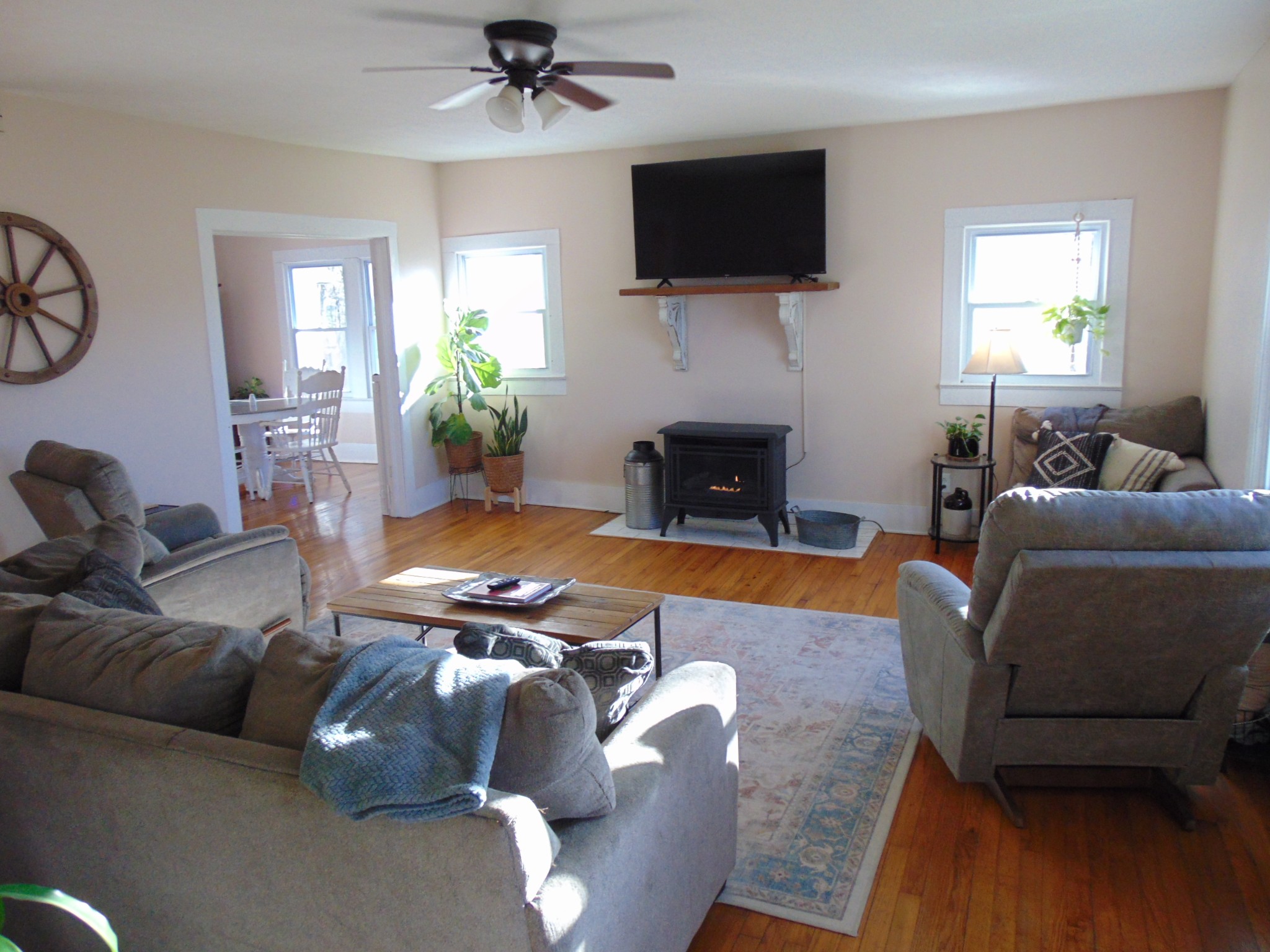 3547 Coffey Branch Road Cornersville, TN 37047 - Photo 7 of 57 a living room with furniture a flat screen tv and a fireplace
