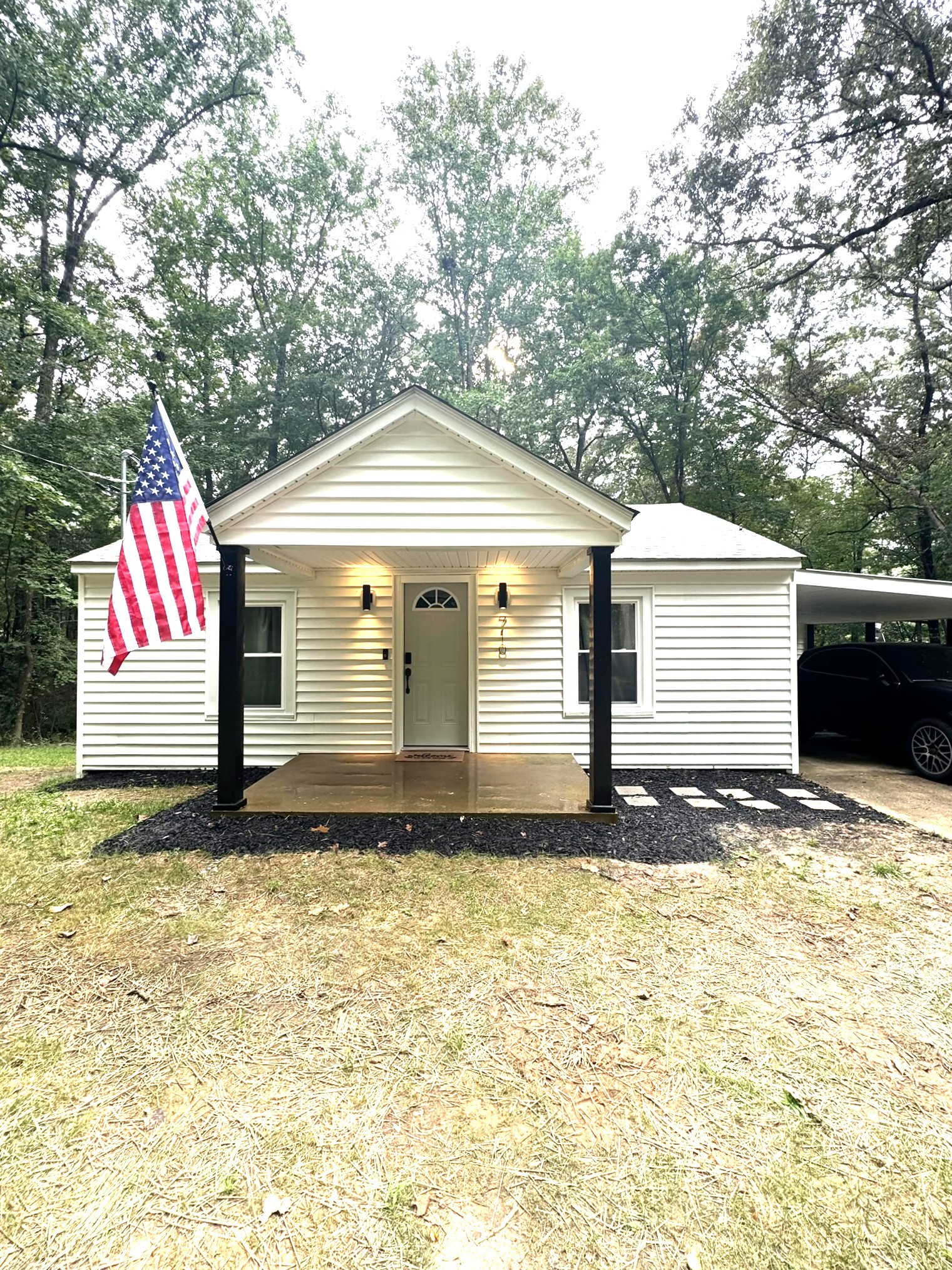 a front view of a house with garden