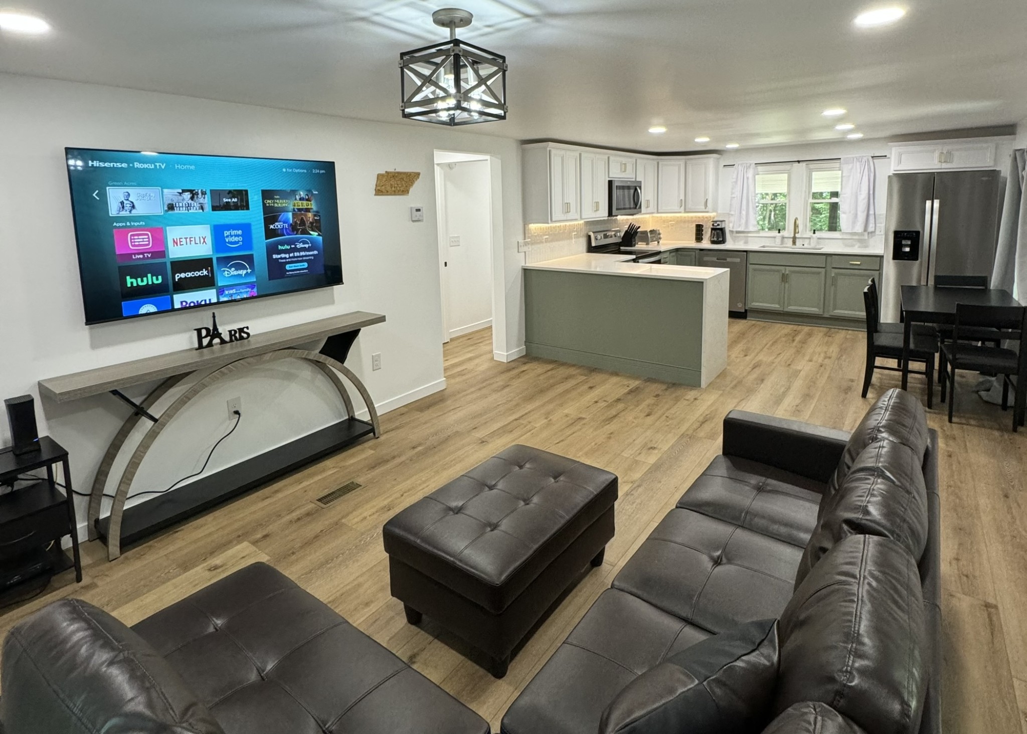 710 3rd Street Paris, TN 38242 - Photo 2 of 34 a living room with furniture and a flat screen tv