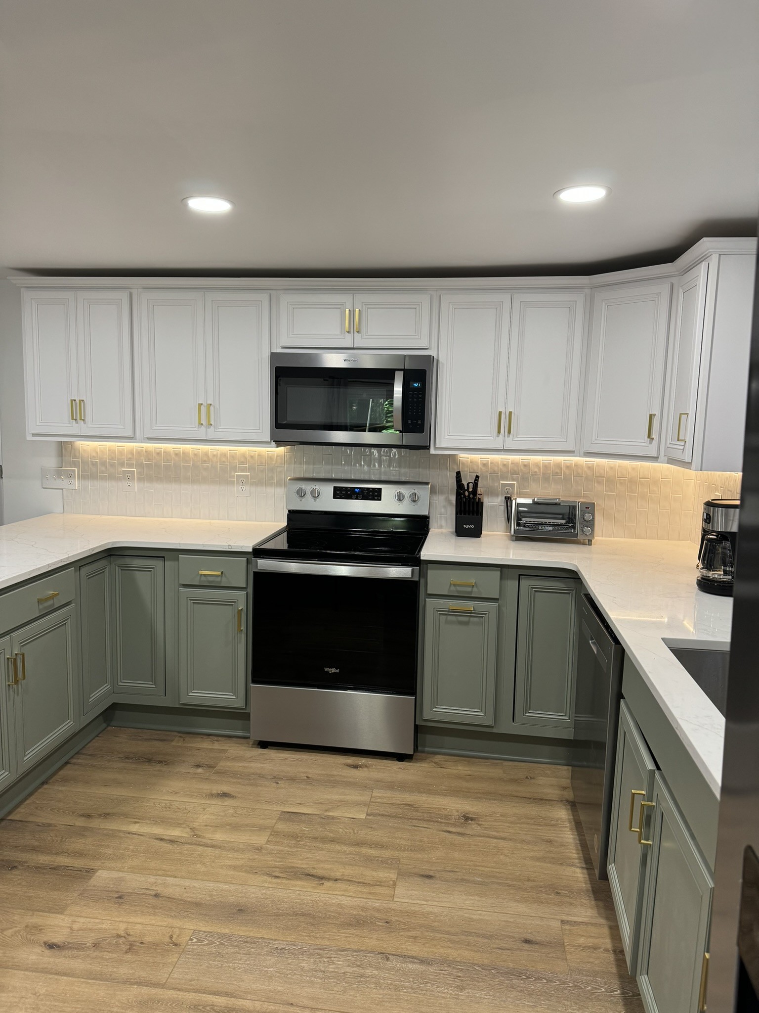 710 3rd Street Paris, TN 38242 - Photo 22 of 34 a kitchen with a sink a stove and cabinets