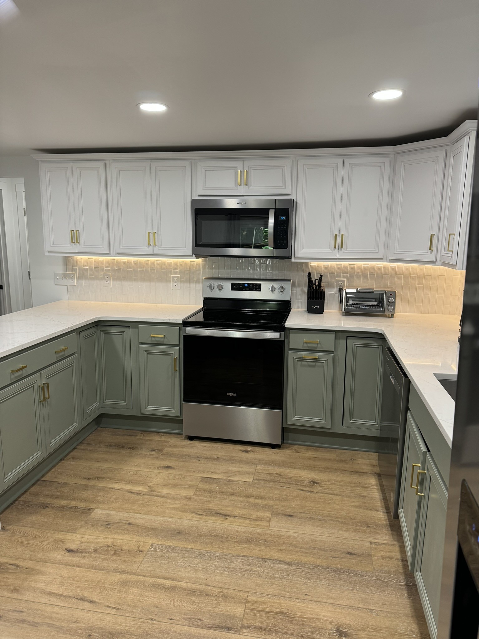 710 3rd Street Paris, TN 38242 - Photo 23 of 34 a kitchen with stainless steel appliances granite countertop a sink and stove top oven