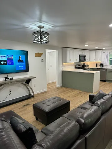 a room with furniture and a flat screen tv