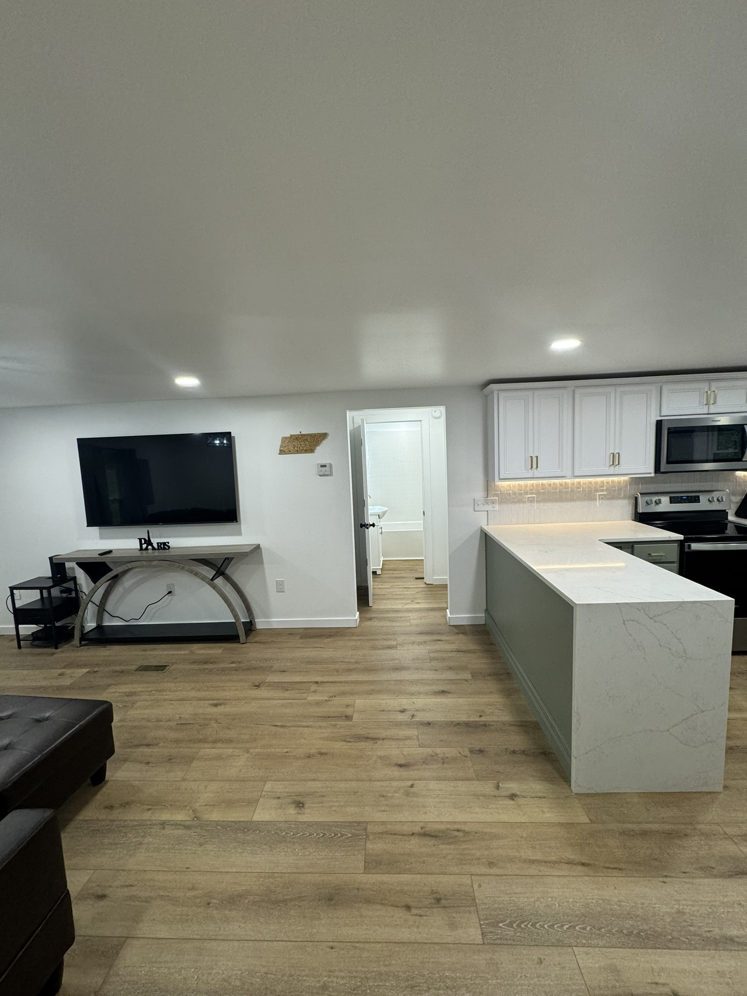 710 3rd Street Paris, TN 38242 - Photo 28 of 34 a living room with stainless steel appliances furniture and a flat screen tv