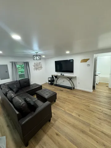 a large kitchen with a table and chairs