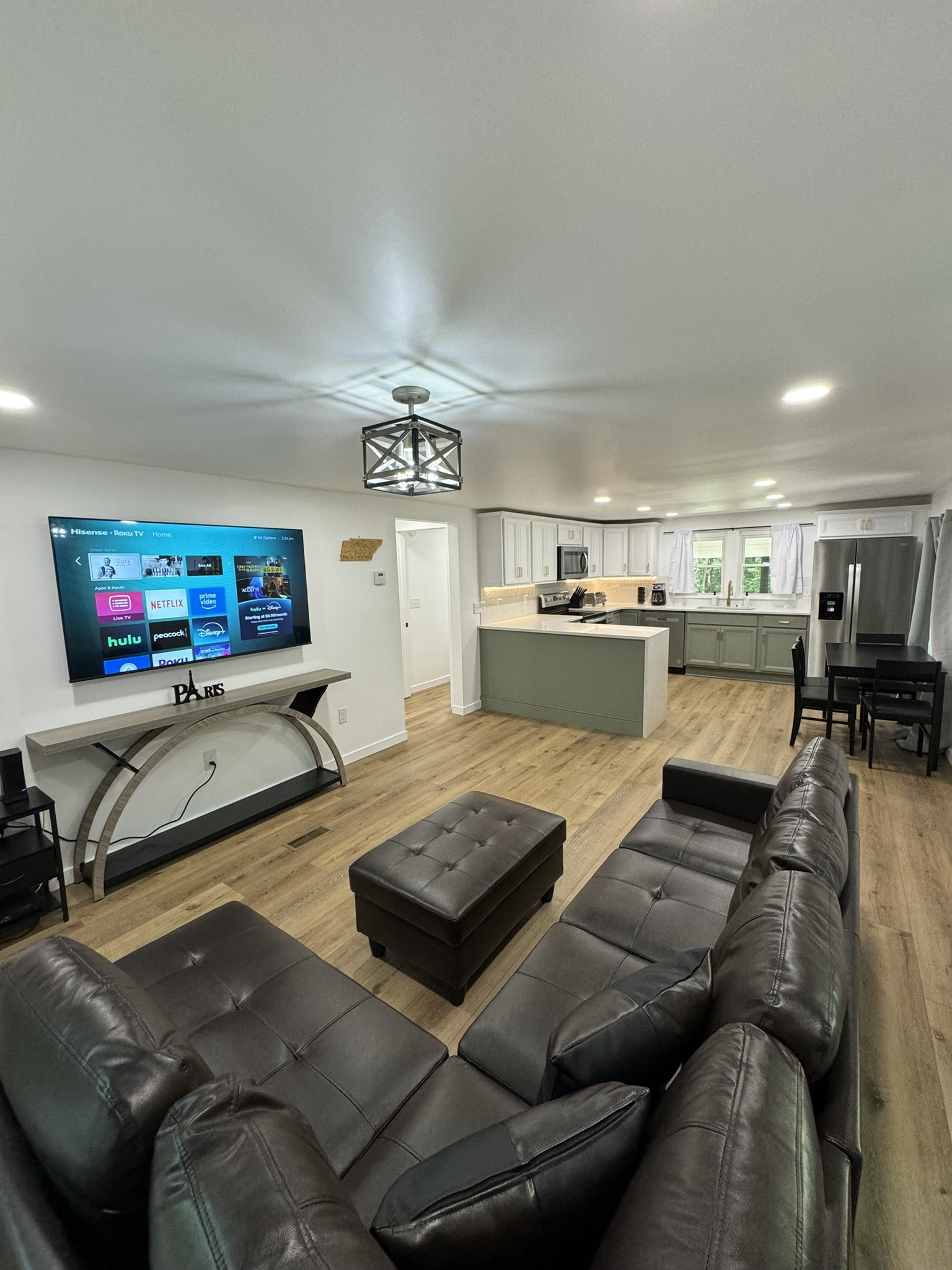 710 3rd Street Paris, TN 38242 - Photo 3 of 34 a living room with furniture and a flat screen tv