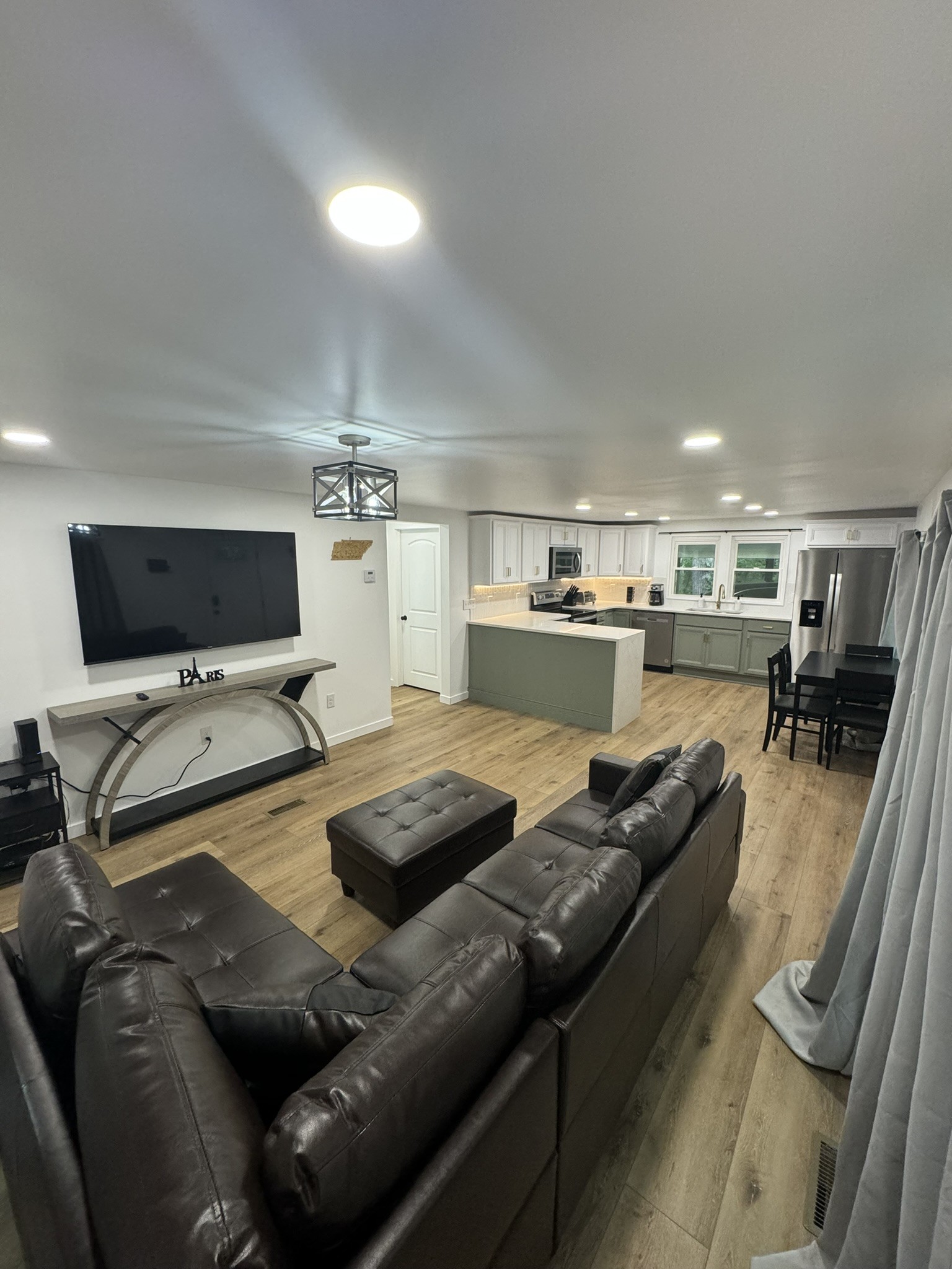 710 3rd Street Paris, TN 38242 - Photo 31 of 34 a living room with furniture and a flat screen tv
