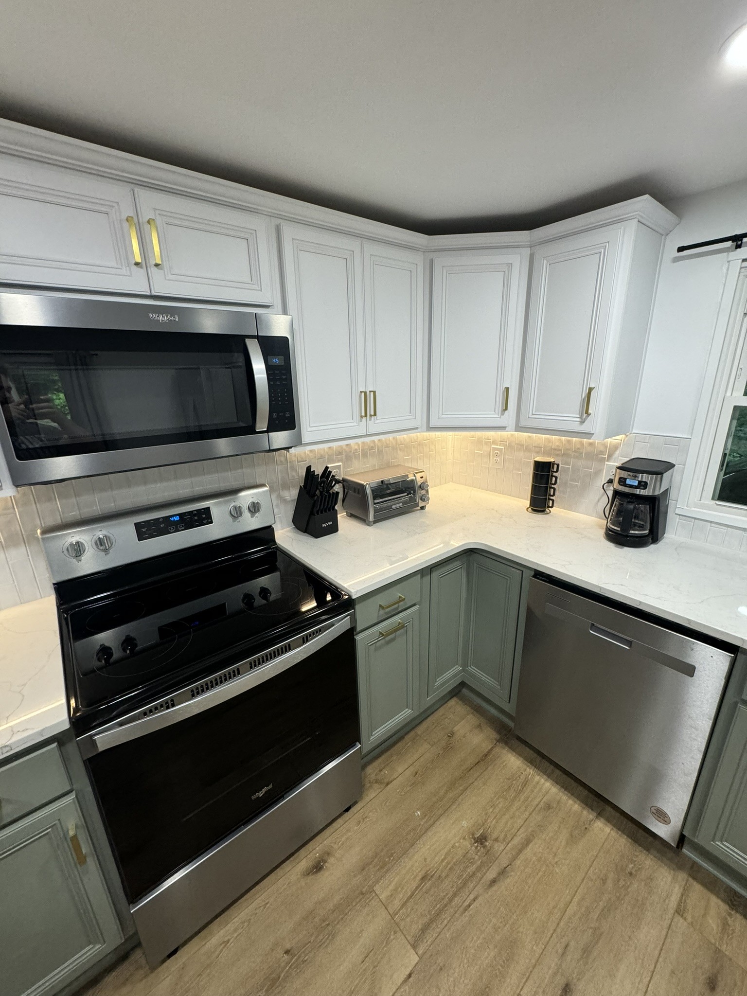 710 3rd Street Paris, TN 38242 - Photo 33 of 34 a kitchen with granite countertop a stove and a microwave