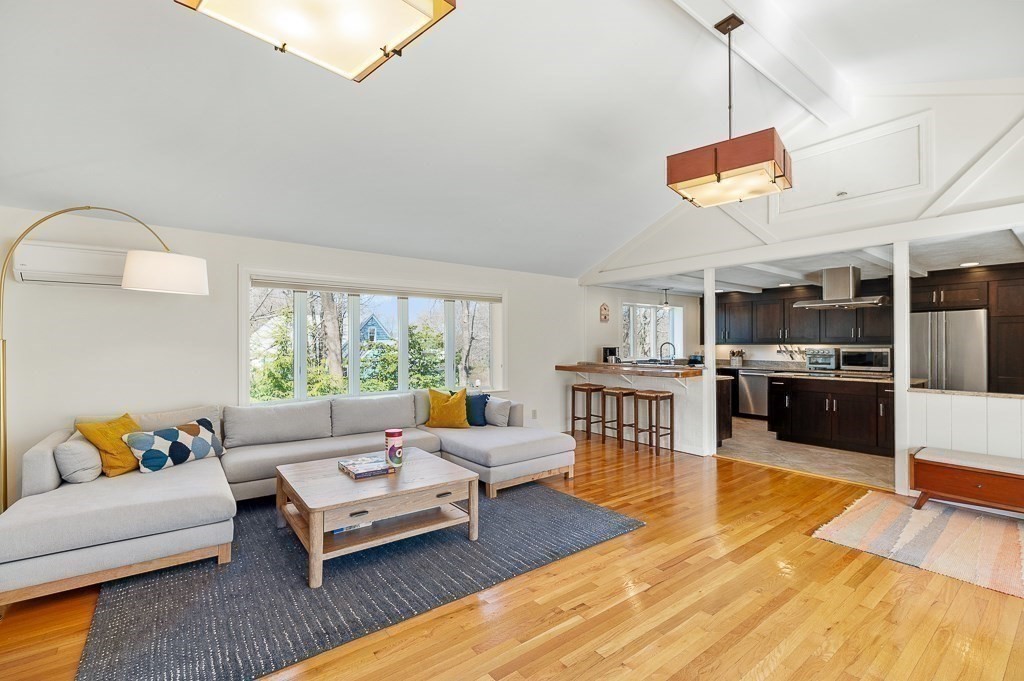 39 Decatur Street, Unit WINTER Gloucester, MA 01930 - Photo 11 of 38 a living room with furniture and kitchen view