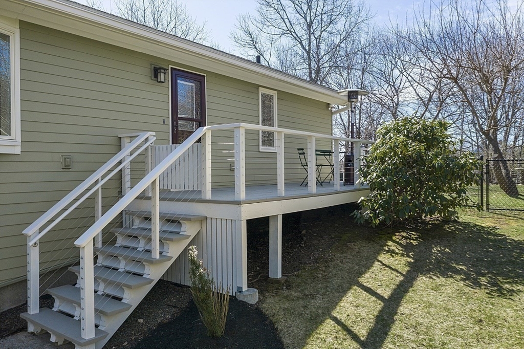 39 Decatur Street, Unit WINTER Gloucester, MA 01930 - Photo 24 of 38 a house with trees in front of it