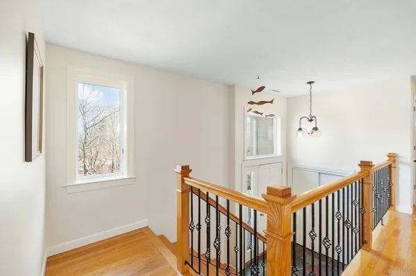 a view of a hallway with windows