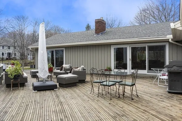 a view of a patio with couches and potted plants