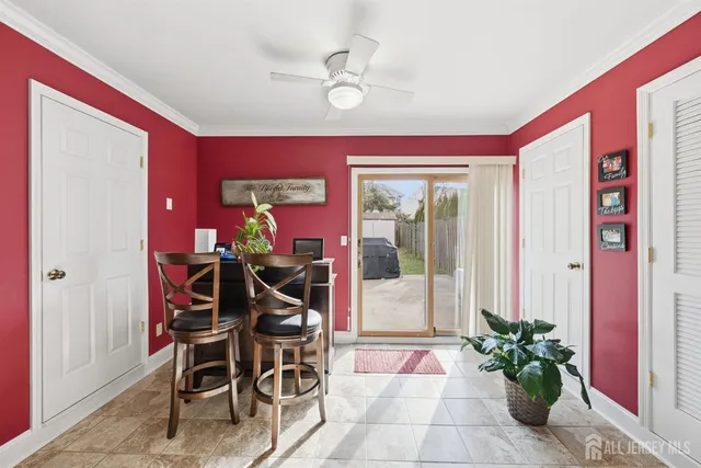 a view of a livingroom with furniture and a potted plant