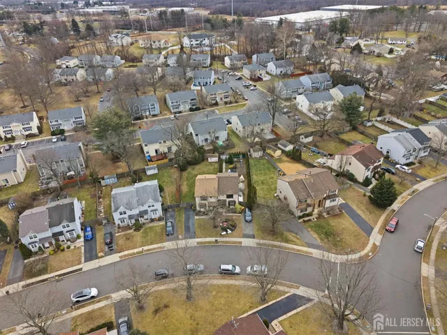 an aerial view of a house with a yard